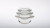 Disko. Raviers en verre mécanique. Trois tailles. Eléments empilables entre-eux. <br />Dimensions : H 67mm, H 83mm, H 103mm. <br />Design : Laurence Brabant, 2009.<br /> <br />Crédit photographique : Xavier Nicostrate.<br /><br /><br /> - Laurence Brabant Alain Villechange