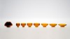 Set of seven small bowls in amber glass. <br />Signed, numbered edition from 1 to 50 ex. + 1A.<br />Dimensions : diameter 90mm, total heigh 53mm.<br /><br />Photographic credit : Xavier Nicostrate. - Laurence Brabant Alain Villechange