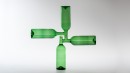 Equilibre, vert 1, 2009. Composition of four bottles that are stable only with water inside. Bottles are blown and then fused together. Height 550mm, width 550mm and diameter 70mm.<br />Design and making : Alain Villechange. 2009.<br /><br />Photgraphic credit : Xavier Nicostrate. - Laurence Brabant Alain Villechange