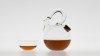 TEA BALL. Teapot with a massive handle and a cork as stopper. <br />Dimensions : diameter 180mm, height, 188mm. Capacity 75cl. <br />Matching bowl : diameter 90mm.<br /><br />Photographic credit : Xavier Nicostrate. - Laurence Brabant Alain Villechange