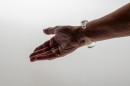 Poetic element of reverie and play like a child, this glass bangle mixes liquid and gas. The air bubble floats in the liquid and navigates according to the movements of the wrist. Far from a mechanical aesthetic, each piece, unique, requires great dexterity for its manufacture. Sculpted without mold each piece will be of an identical aesthetic but slightly variable dimensions. Easy to wear and adopt.<br />Photo credit : Xavier Nicostrate. - Laurence Brabant Alain Villechange