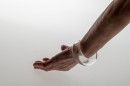 Poetic element of reverie and play like a child, this glass bangle mixes liquid and gas. The air bubble floats in the liquid and navigates according to the movements of the wrist. Far from a mechanical aesthetic, each piece, unique, requires great dexterity for its manufacture. Sculpted without mold each piece will be of an identical aesthetic but slightly variable dimensions. Easy to wear and adopt.<br />Photo credit : Xavier Nicostrate. - Laurence Brabant Alain Villechange