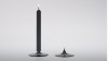 A LA POINTE. Candleholder with a masive glass point. As this glass is heat resistant, warm the point with a lighter and push the candle on the hot point. Grey glass. Diameter 95mm.<br /><br />Photographic credit : Xavier Nicostrate. - Laurence Brabant Alain Villechange